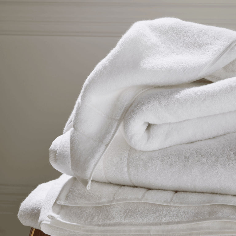 Premium Photo  Stack of clean towels on bed indoors space for text